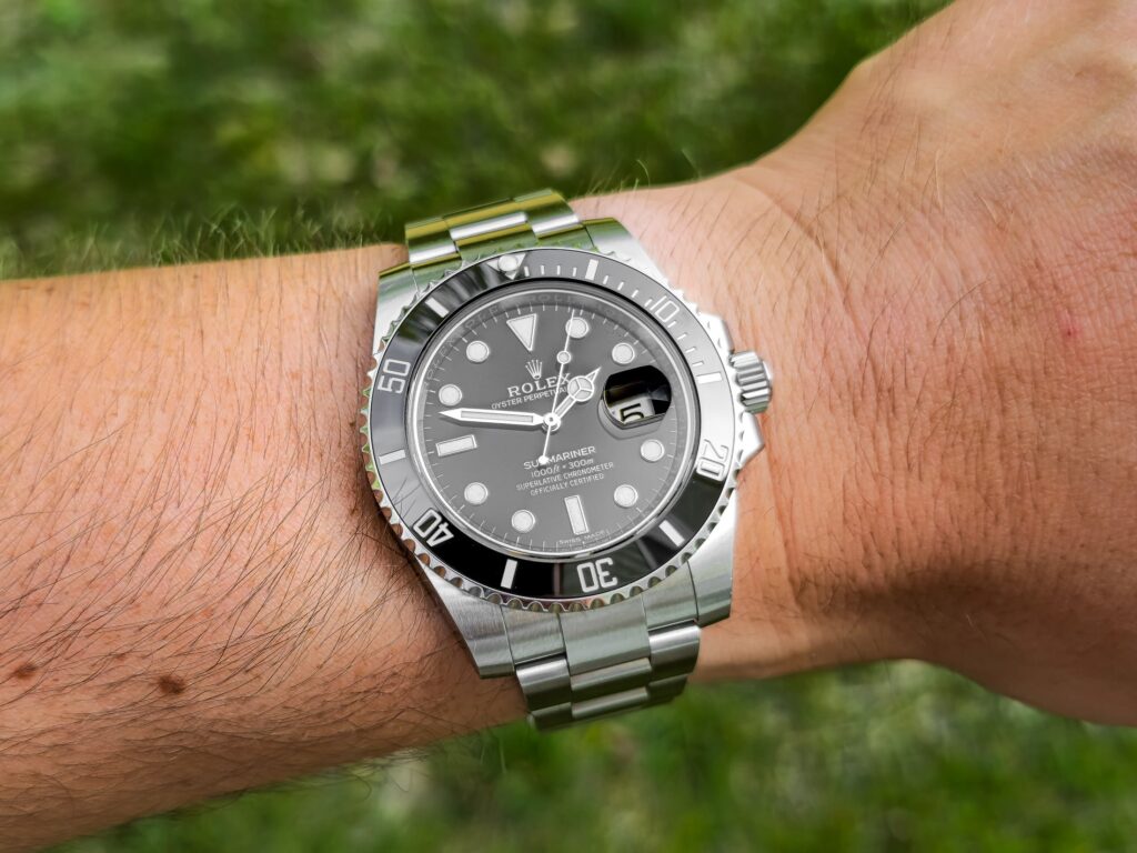 Image of man wearing Rolex luxury watch