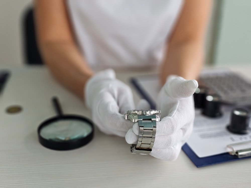 An expert Le Watch Buyer appraiser handles an Audemars Piguet Royal Oak watch.