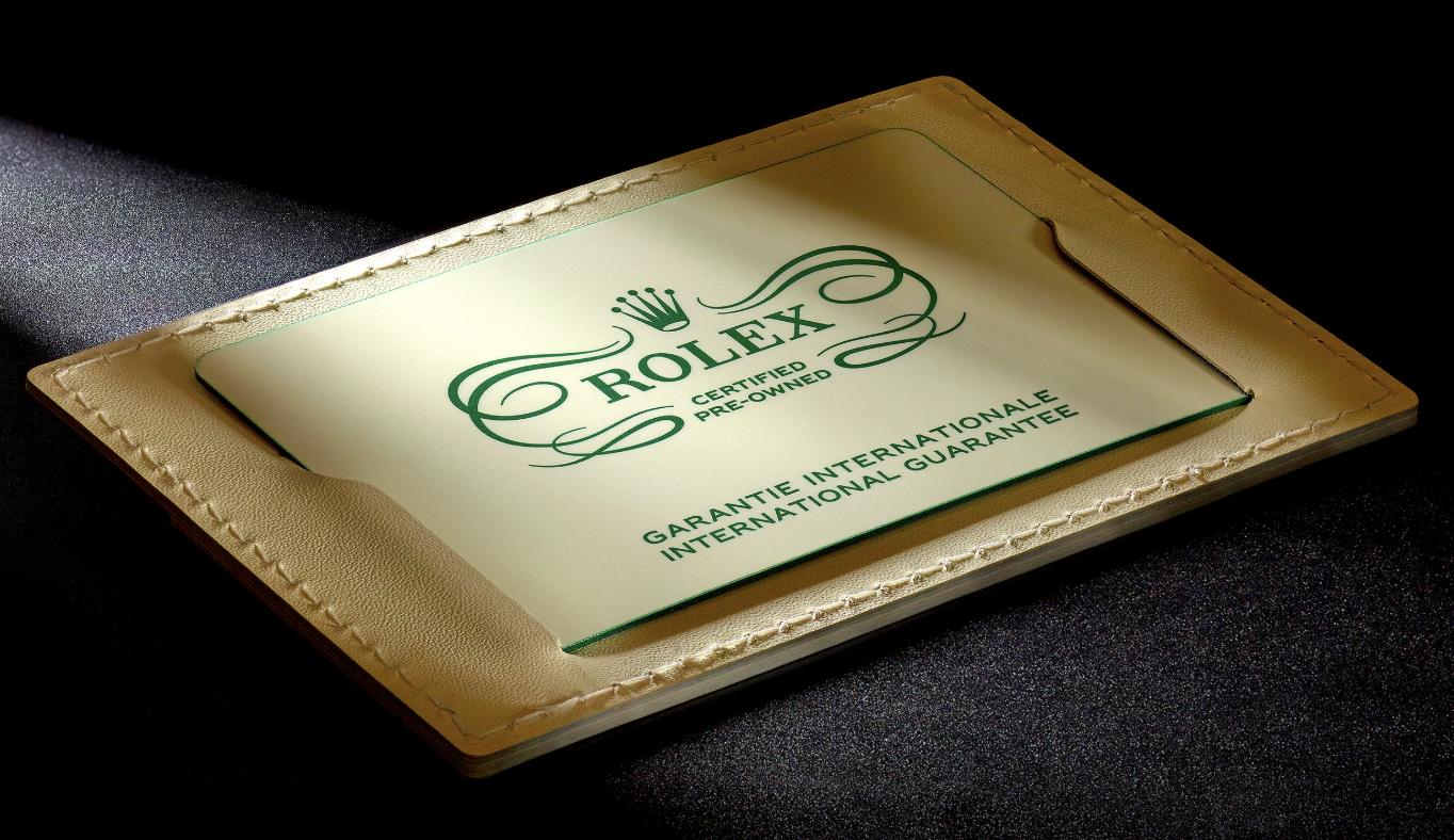 Official Rolex Certified Pre-Owned guarantee card and papers — the documentation issued with every RCPO-certified watch, including the two-year international guarantee.
