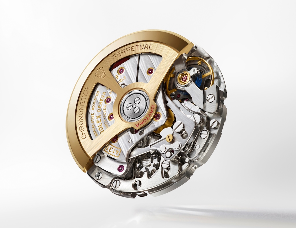 Rolex Calibre 4131 automatic chronograph movement visible through the exhibition sapphire caseback of the Daytona 126502 — 72-hour power reserve, yellow gold skeletonized rotor.