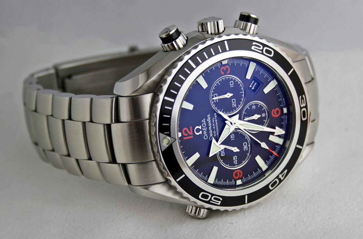 Omega Seamaster chronograph with a blue dial, black bezel and stainless steel bracelet